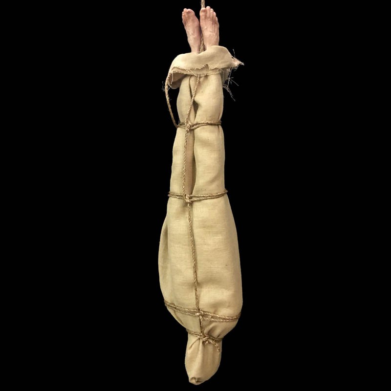 BURLAP WRAPPED BODY WITH EXPOSED FEET