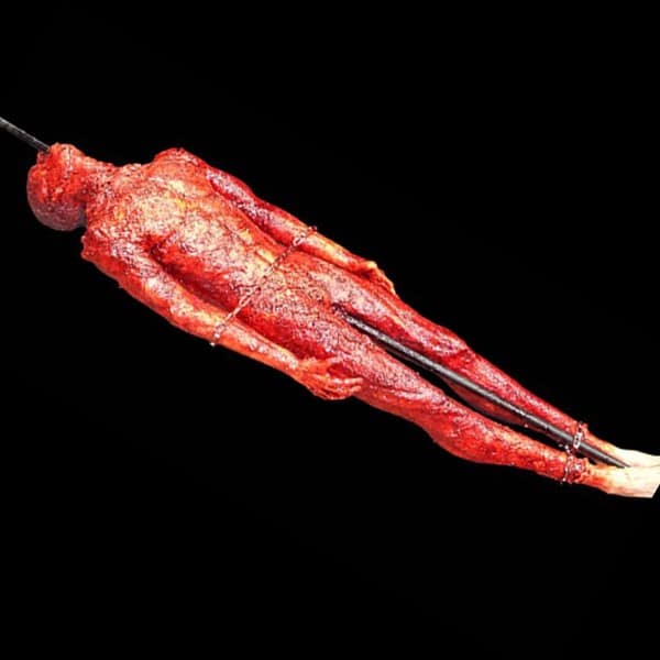 ROASTING MAN PROP ON A STEEL SPIT (94′ x 1′ STEEL PIPE).